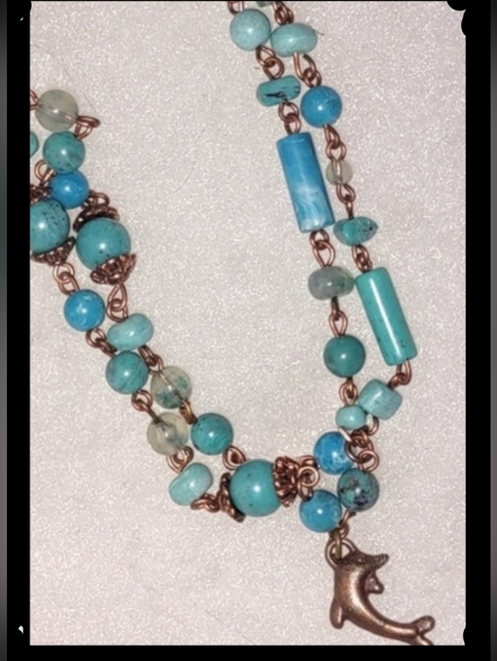 Copper Dolphin Charm on Aqua Blue Beaded Chain Bracelets